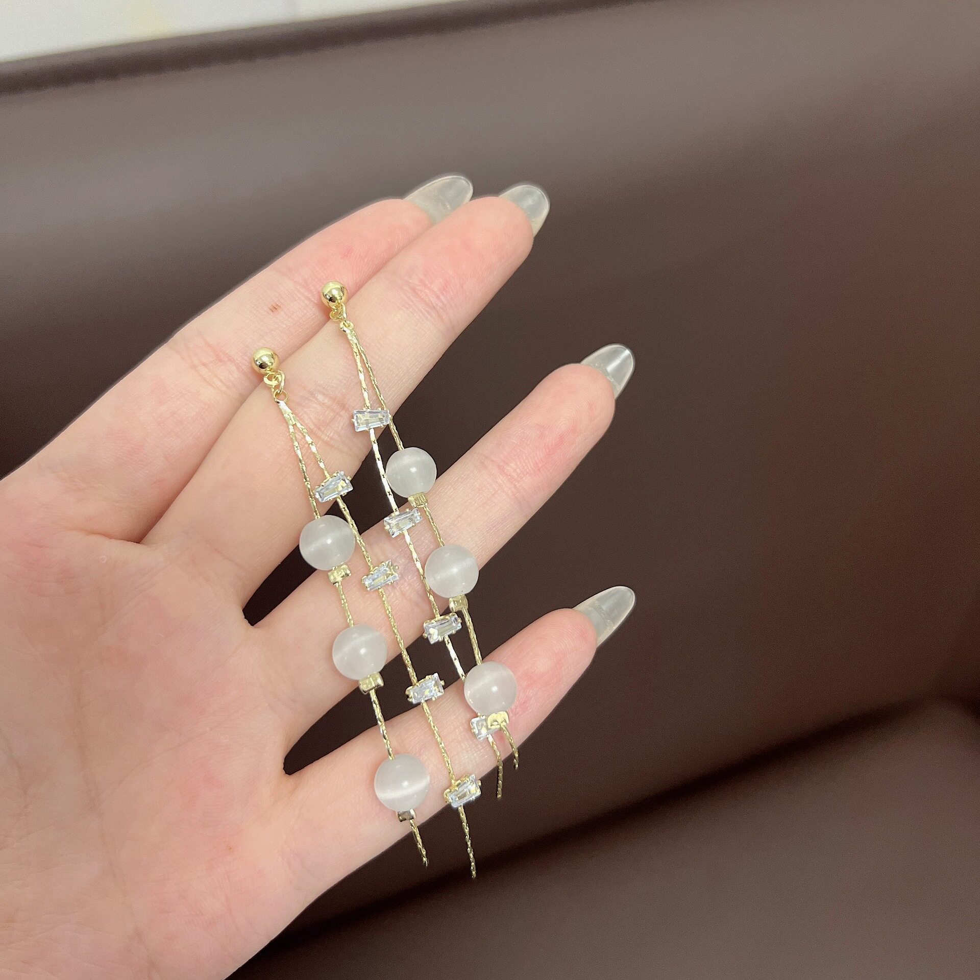 撤柜法式甜美超仙优雅长款猫眼石流苏耳线网红同款度假风时尚气质