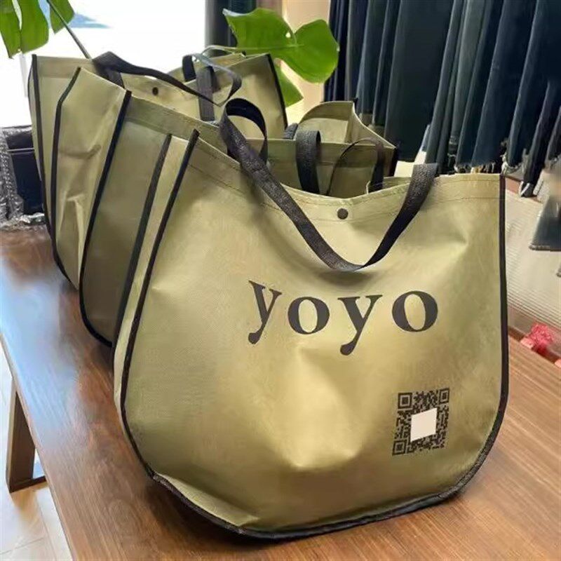 无纺布袋子定做印logo定制购物环保服装手提袋广告订制月亮袋订做