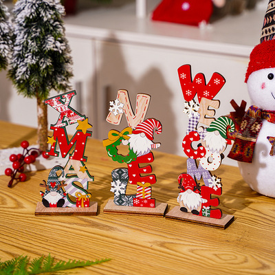 Christmas decorations featuring wooden faces, painted doll