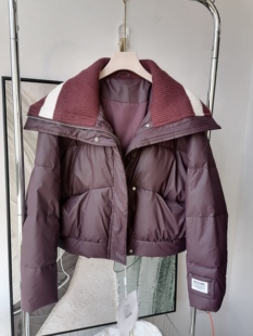 欧版休闲白鸭绒皮料羽绒服女针织大翻领时尚保暖加厚短款外套2024