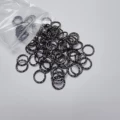 1.0 Gun Black Round Embossed Circle (about 80 Pieces)