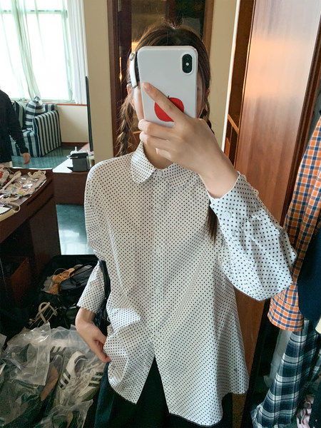 White long-sleeve polka dot button-up shirt worn in a mirror selfie