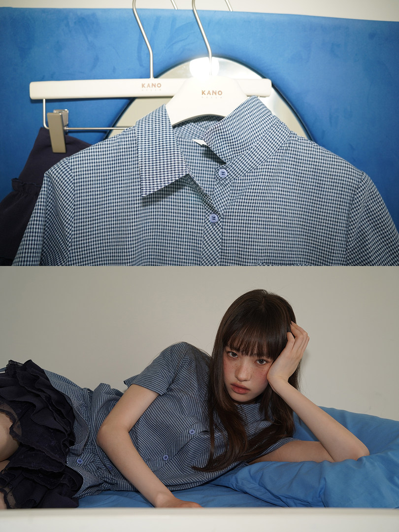 Blue gingham short-sleeve button-up shirt shown on a hanger and worn by a model
