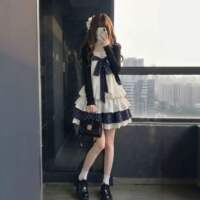 A petite student in the school style wears a sweet two-piece outfit of a long-sleeved French cardigan and a halter dress for early autumn thumbnail 2