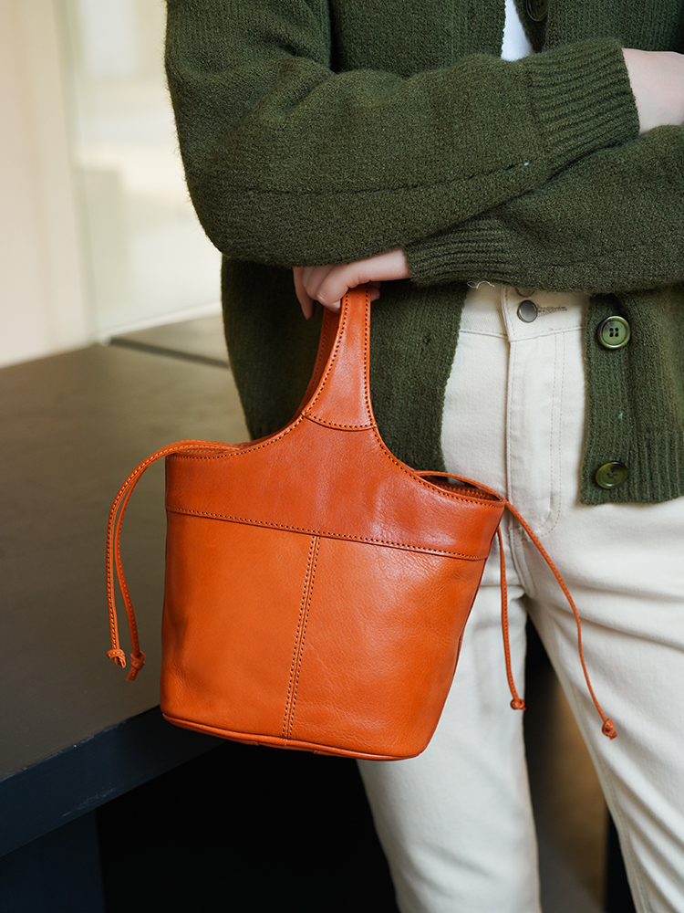 转山头层牛皮花篮包正品