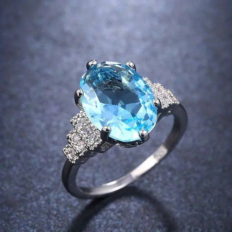 精致蓝宝石镶钻戒指女士时尚百搭椭圆形宝石指环