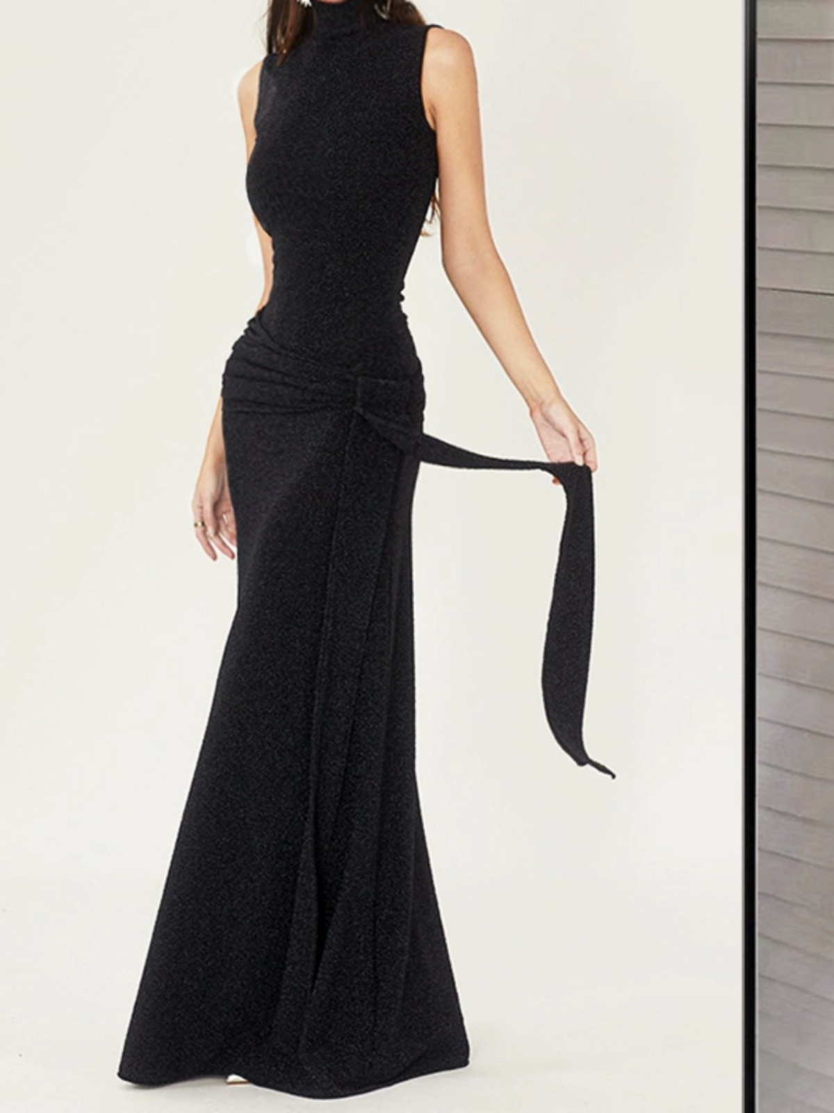 Fitted long black brace, evening dress, skirt, hip-accented Fitted long black brace, evening dress, skirt, hip-accented