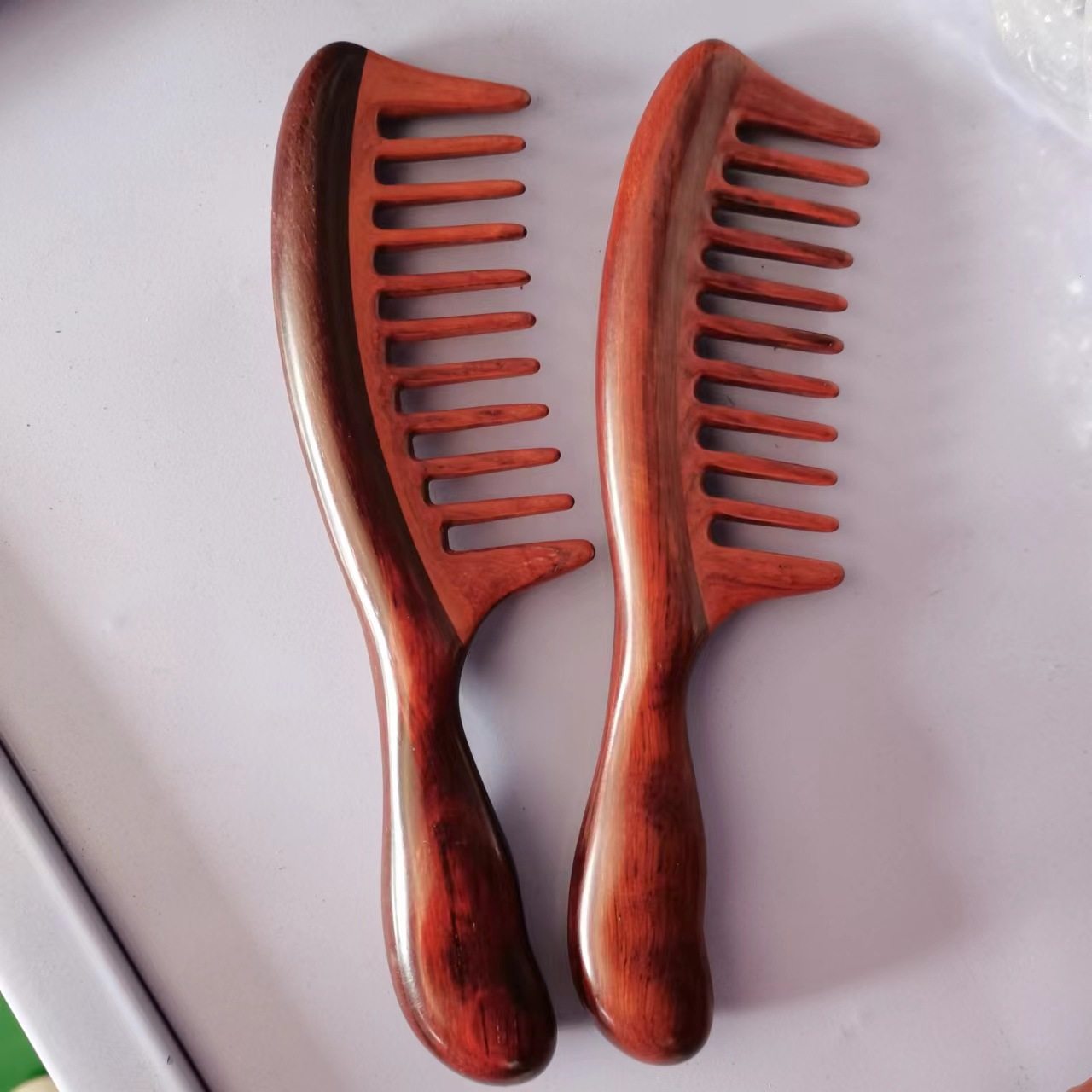 紫檀按梳子紫檀宽齿按经络梳檀木梳按梳整木梳子