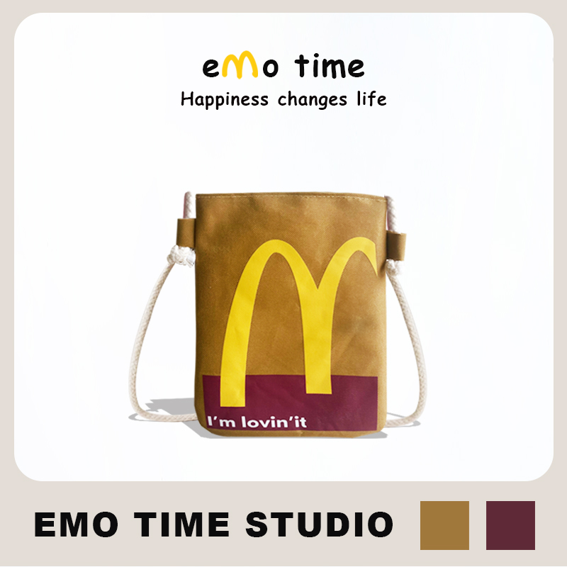 emo原创M记麦麦门帆布抽绳斜跨背包情侣学生休闲个性礼物收纳包