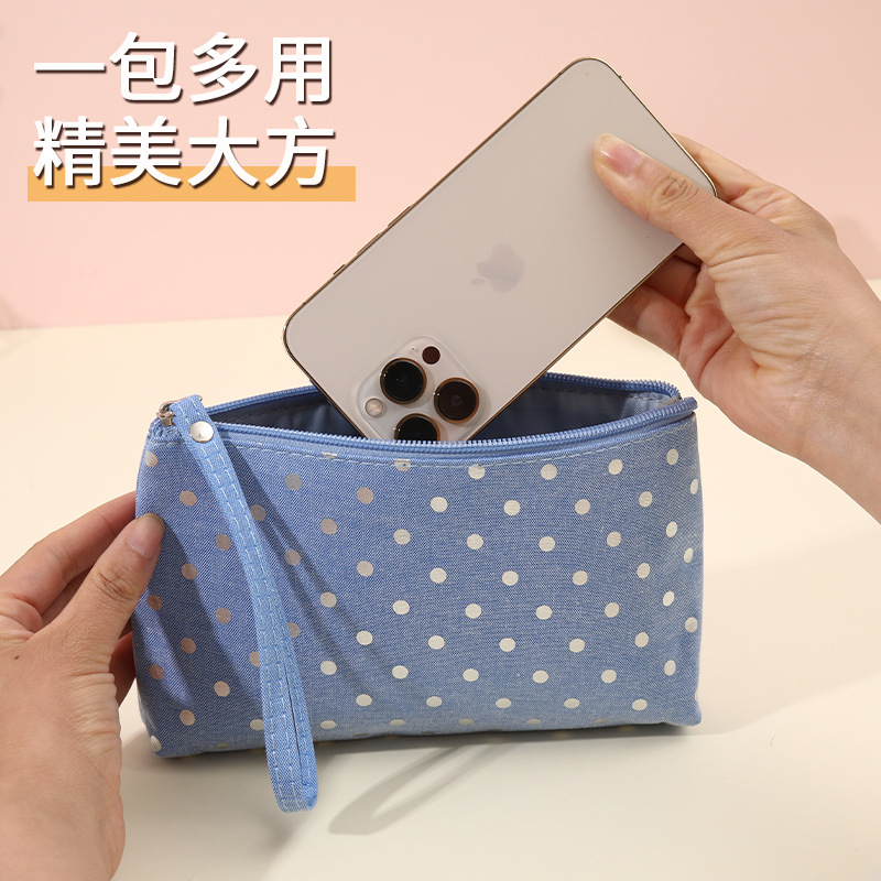 圆点化妆包甜美护肤品收纳包手拎便携式小零钱包旅行手拿洗漱包