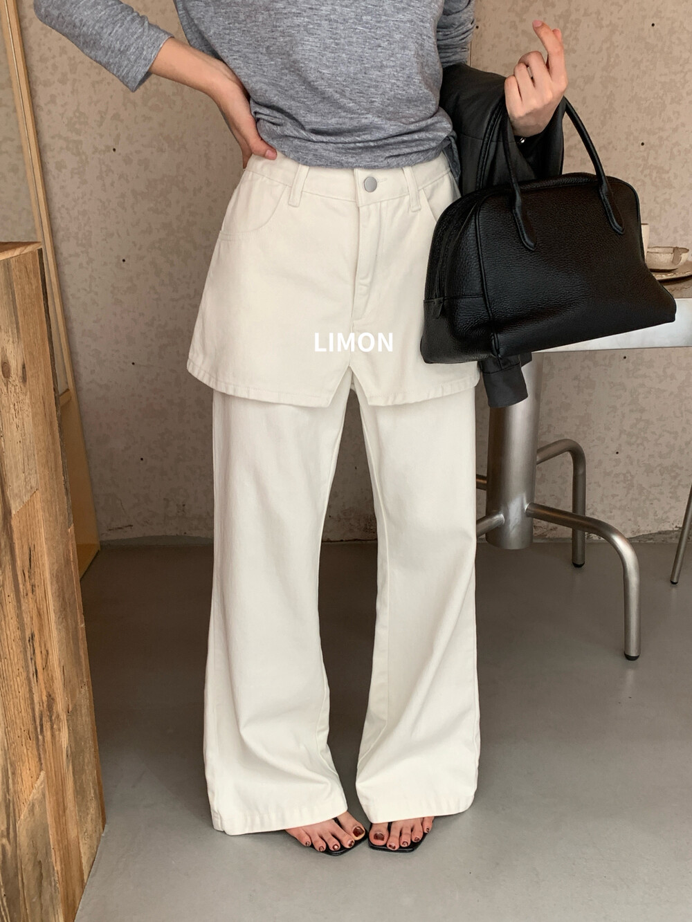 柠檬绿茶2026早秋新款通勤时髦假两件设计感屁帘微喇牛仔裤女休闲