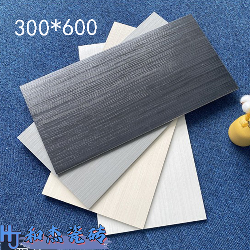 佛山北欧灰色木纹瓷砖300X600客厅卧室民宿 仿实木纯色防滑墙地砖