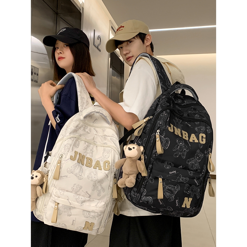2025新款书包男生初中生高中大学生印花女生背包小学生旅行双肩包