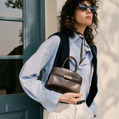 ELLE牛皮小号手提包通勤抱抱包女