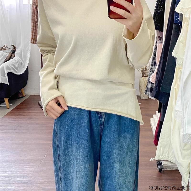 十三行2025秋装慵懒风斜领宽松韩版卡其杏开叉不规则针织衫上衣女