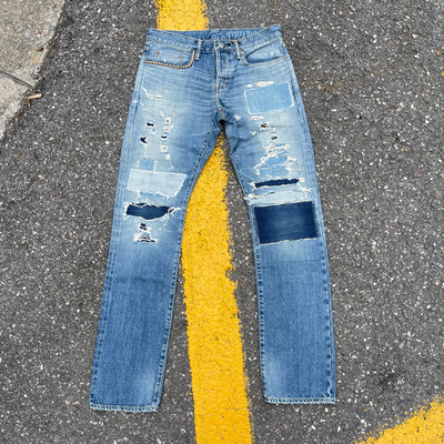 糜烂刀割补丁水洗牛仔裤