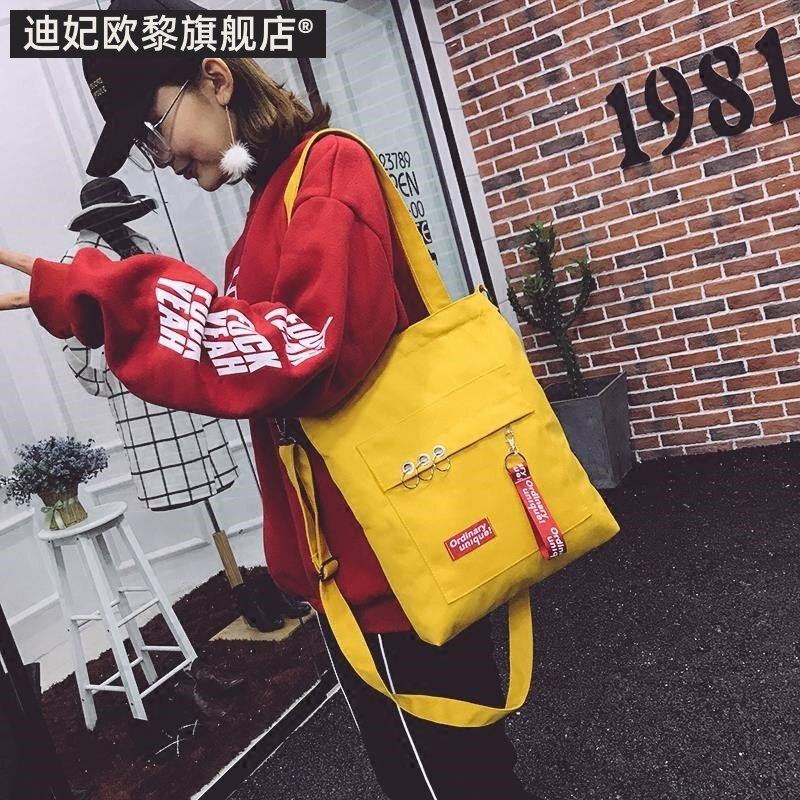 2019新款小学生补习袋帆布手提袋男女拎书袋初中生书包包斜挎单。