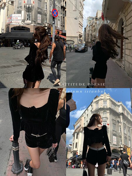Black long-sleeve crop top and shorts outfit worn by a model in an urban street setting