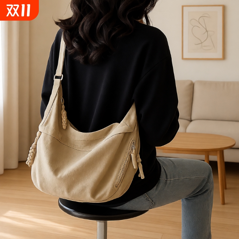 斜挎饺子包女2025新款包包通勤单肩背包日系容量大男潮流运动轻便