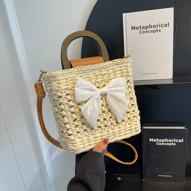 质感小众草编包包2023新款女包夏天时尚沙滩包镂空斜挎包水桶包