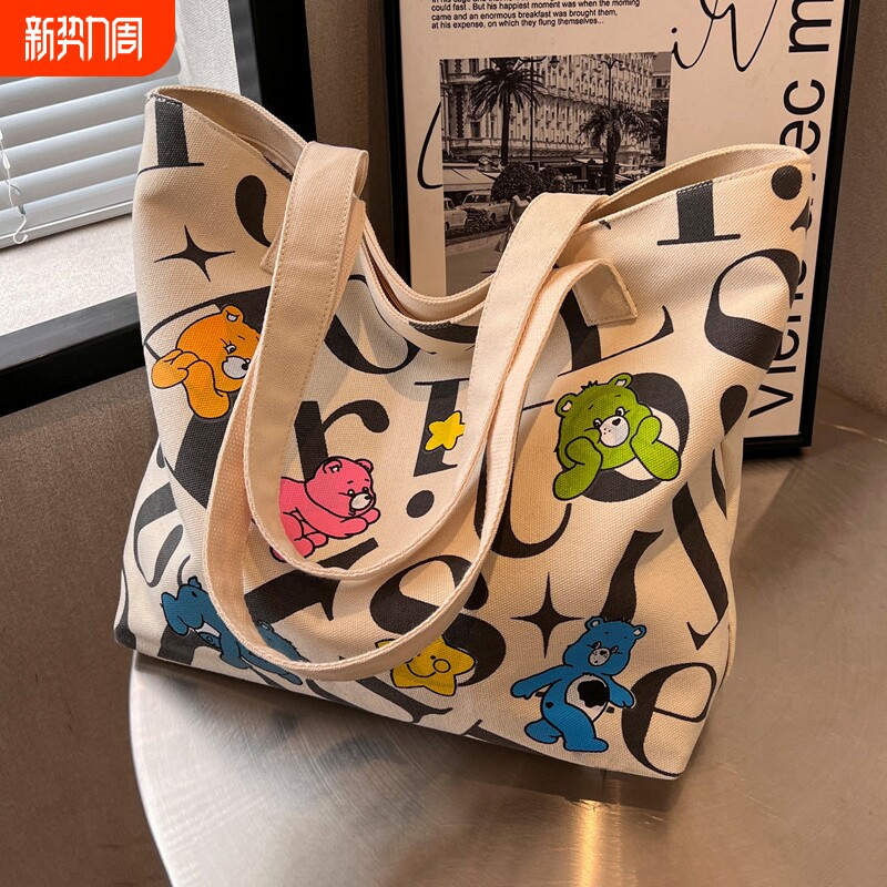 学生帆布包女大容量托特包2024新款百搭妈咪包手提单肩购物袋小包