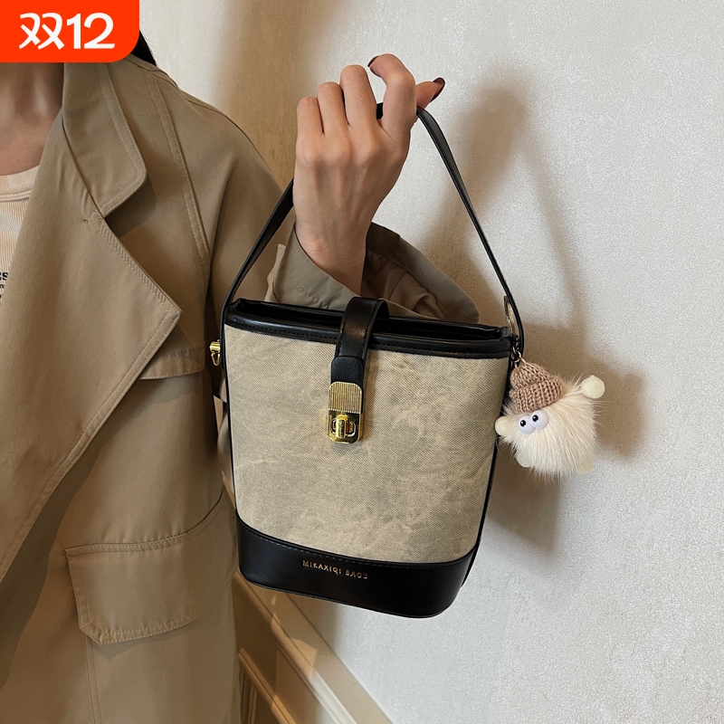 伊布古奇复古包包女款2025手提水桶包斜挎包时尚百搭简约通勤包