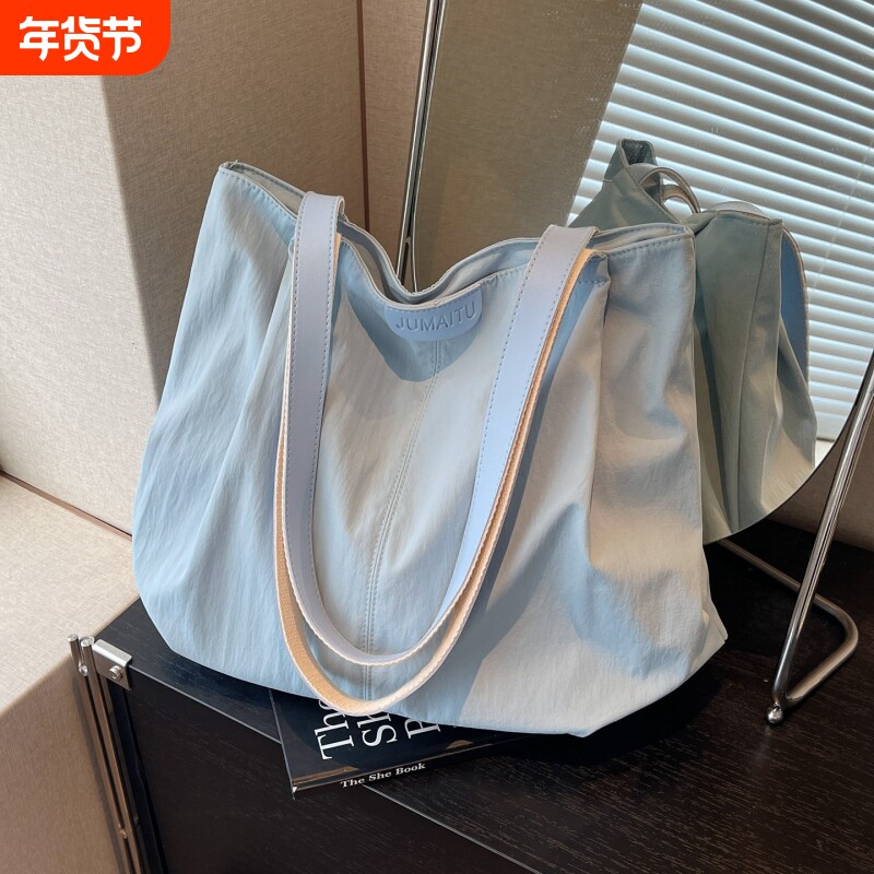 休闲大容量包包女新款轻便单肩包简约百搭帆布托特包大学生通勤包