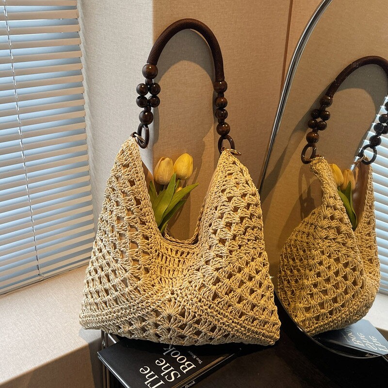 夏天草编包包女2026新款海边度假沙滩镂空单肩托特包编织菜篮子包