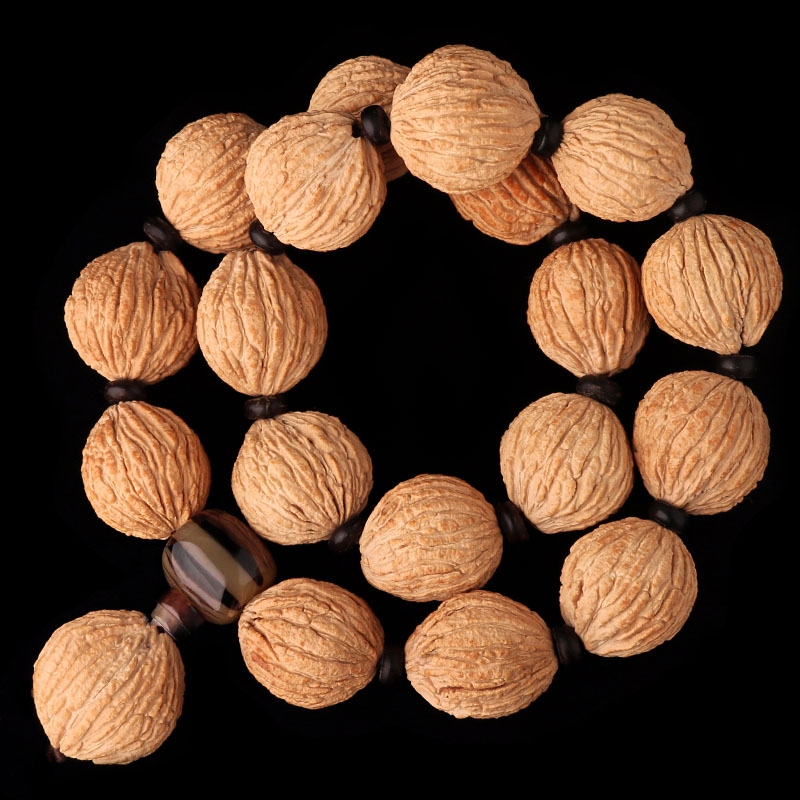 正圆金丝小猴头原籽易红桃核文玩佛珠手持随身盘玩把玩手串男野生