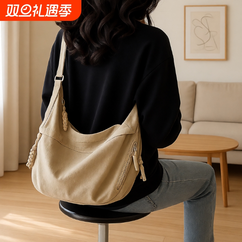 斜挎饺子包女2025新款包包通勤单肩背包日系容量大男潮流运动轻便