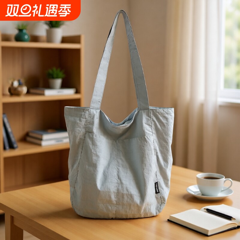 2025单肩背布包文艺轻便托特包新款简约通勤大容量双肩防水折叠