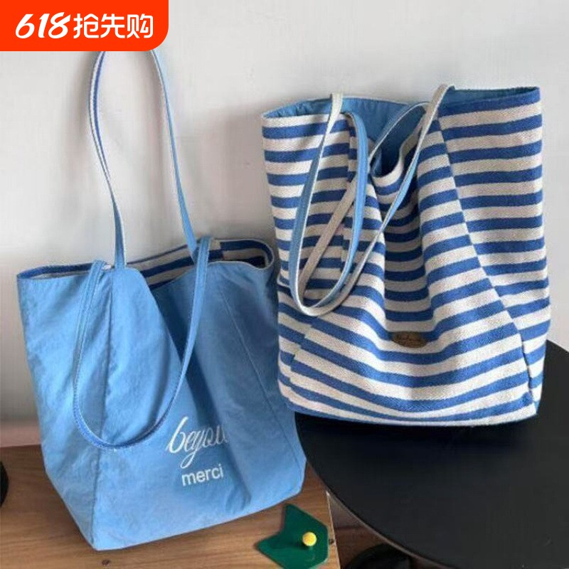 包包女式2025新款条纹双面包帆布袋韩慵懒风托特包红色大容量单肩
