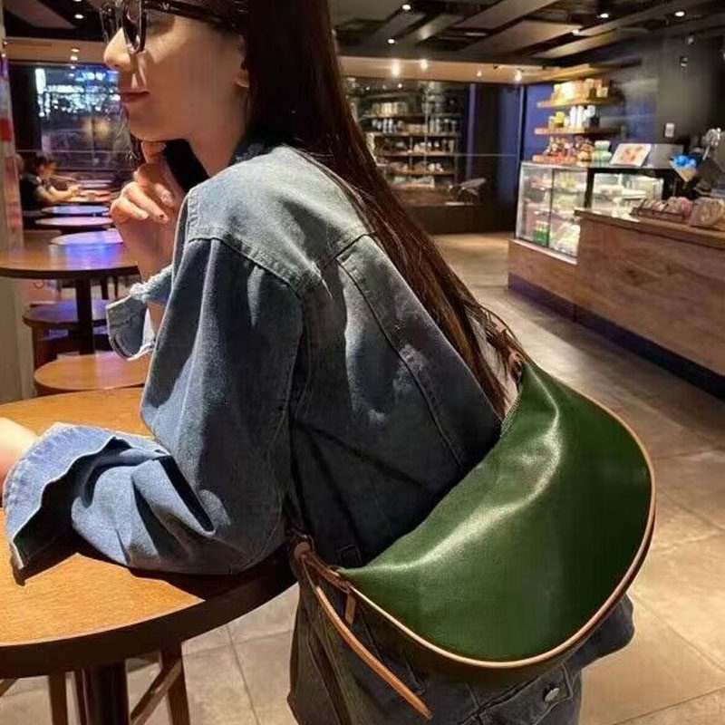梦嘉丽头层树膏牛皮撞色饺子包女