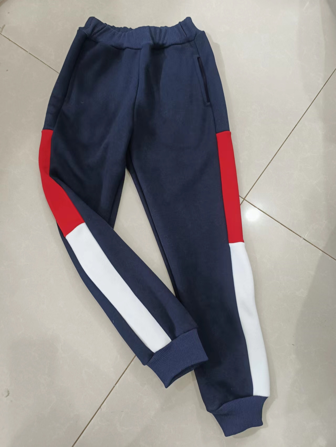 订做纯棉中小学生男女校服长裤深藏蓝色拼上大红下白宽杠运动校裤