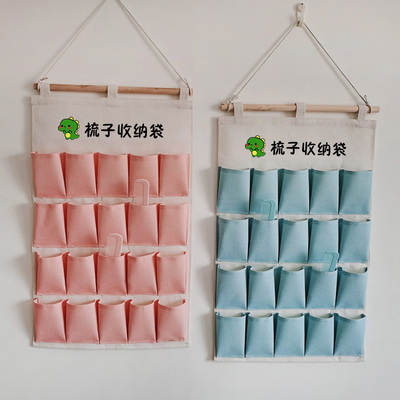 幼教具壁挂式帆布梳子收纳袋儿童梳子发饰口罩口红手表画笔储物袋