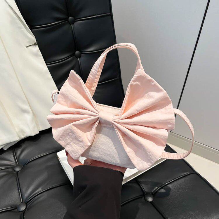 甜美可爱蝴蝶结迷你布包口红包2026新款轻便斜挎儿童包ins小包女