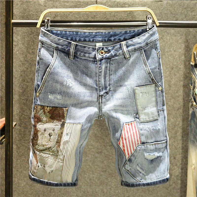 潮牌拼接个性补丁牛仔短裤男斜口袋五分裤夏季痞帅炸街破洞裤子薄