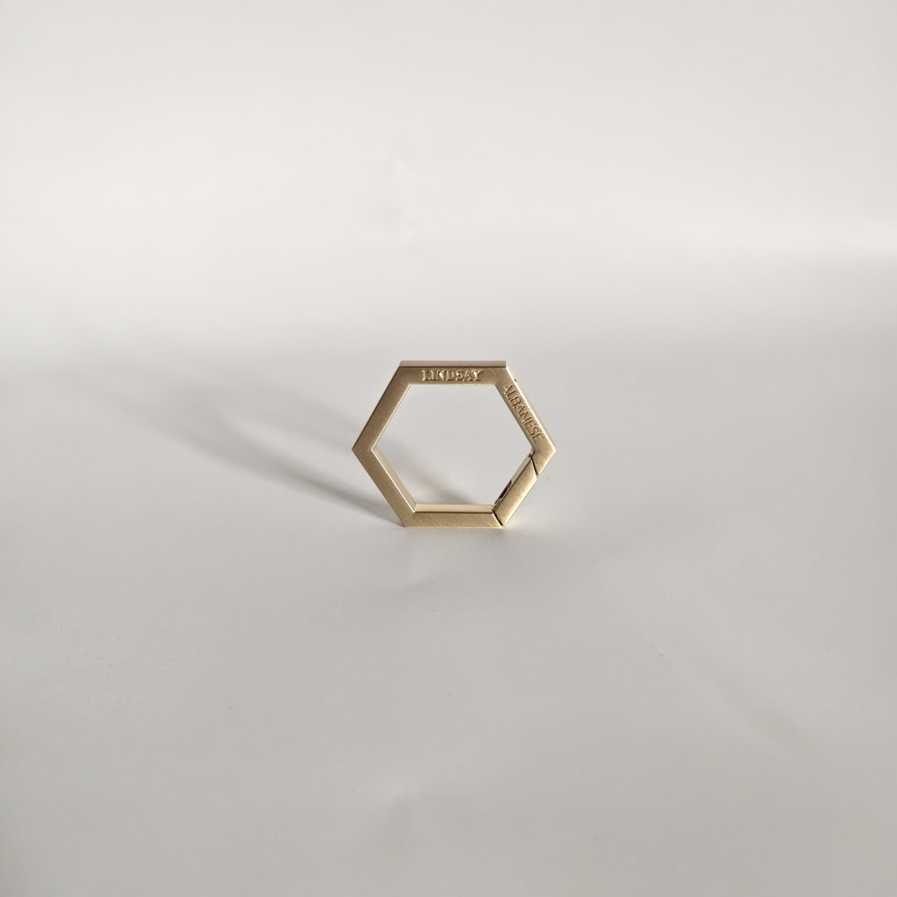 THE OUTER SINGLE BRIGHT GOLD HEXAGONAL KEYCHAIN KEYRING IS ON  FOR 56 US DOLLARS
