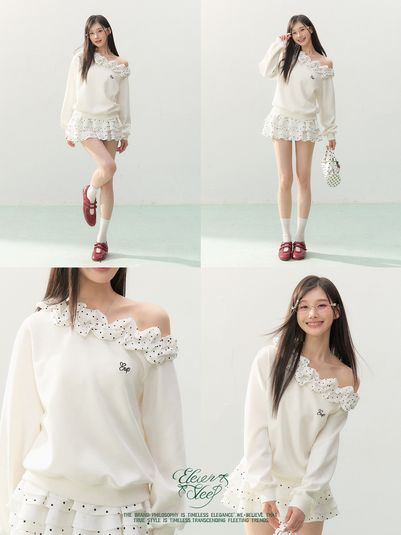 Model wearing a white off-shoulder ruffled top and matching layered mini skirt set