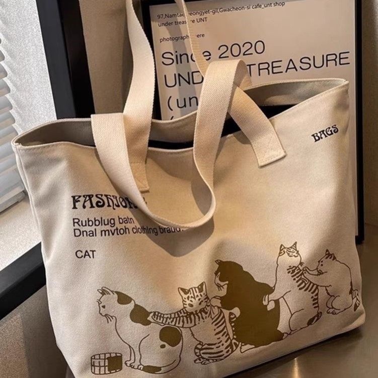 夏季卡通猫咪帆布包包2025新款通勤托特大包大容量旅行单肩手提袋