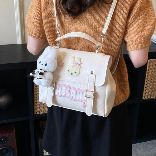 韩版可爱少女风双肩包女2026新款时尚百搭卡通斜挎包学院风通勤包