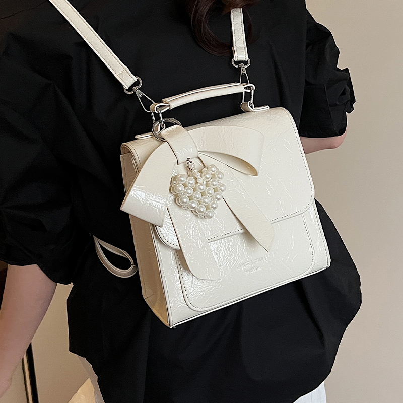 大学生简约百搭蝴蝶结小众双肩包包女2025夏季新款时尚斜挎小方包