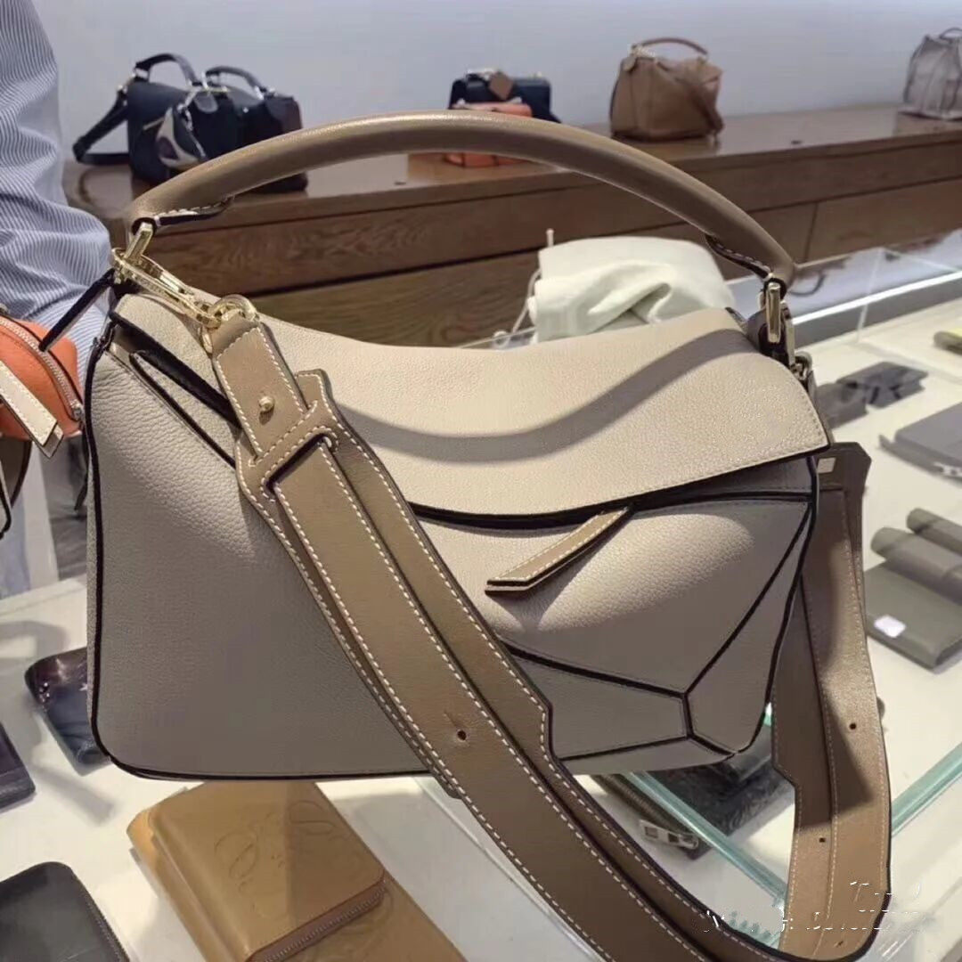 真皮女包2021秋冬新款潮百搭斜挎puzzle几何包菱格波士顿包枕头包