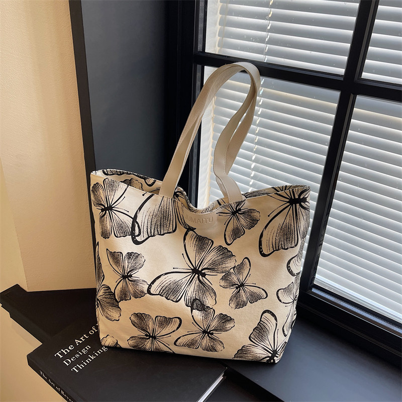 休闲白搭蝴蝶帆布托特包2026新款慵懒风大容量单肩包妈咪包大包女