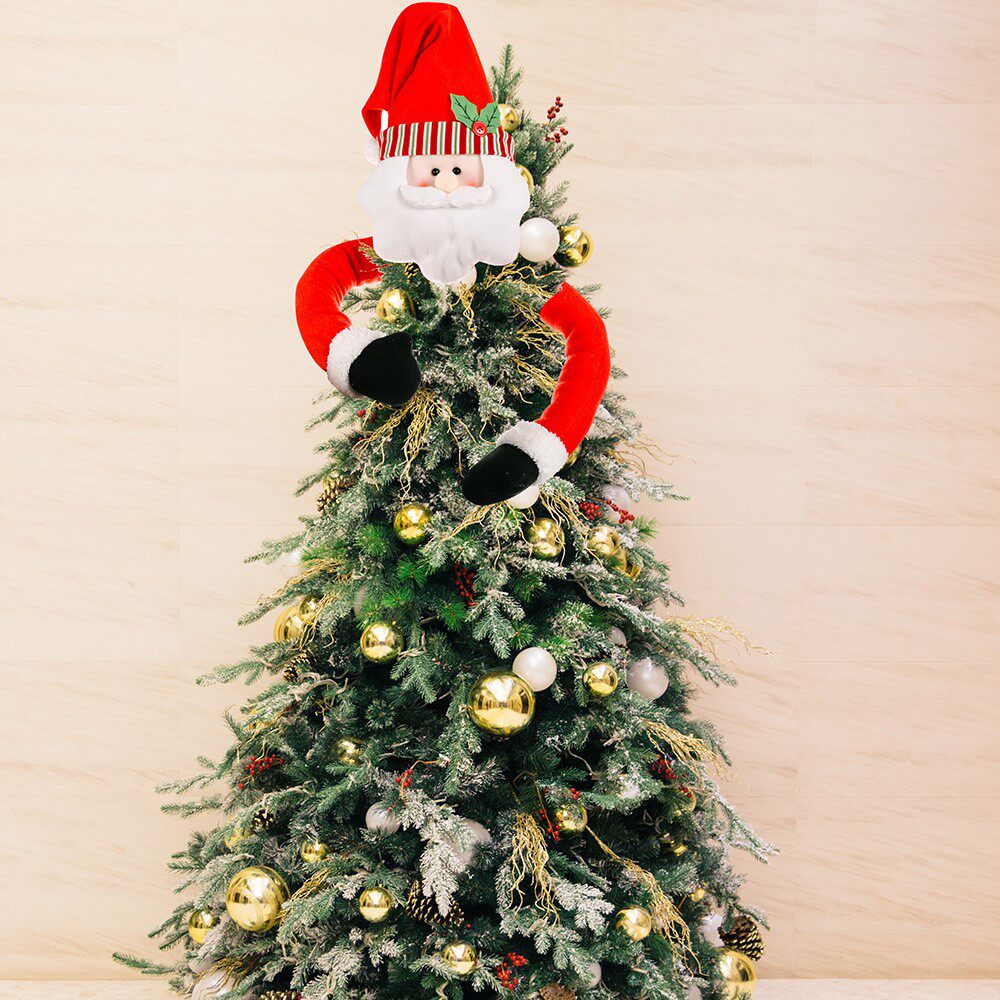 santa claus hugs tree on top of christmas tree圣诞老人抱树