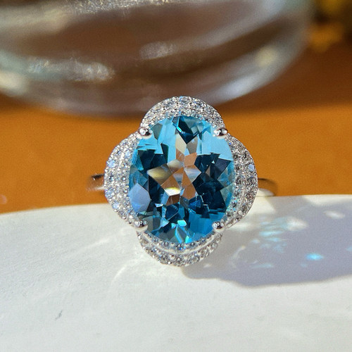 星赞S925纯银镀金圣玛利亚海蓝色天然托帕石戒指四瓣花中式风简约