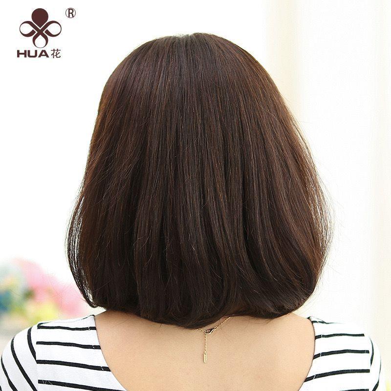 The wig lady has long hair in the head of the wig womans sh