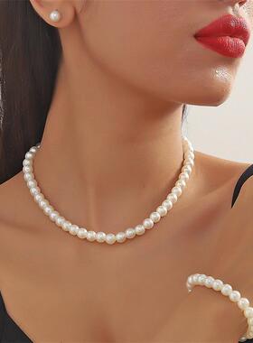 Three pairs of short collared necklaces and earrings nailed