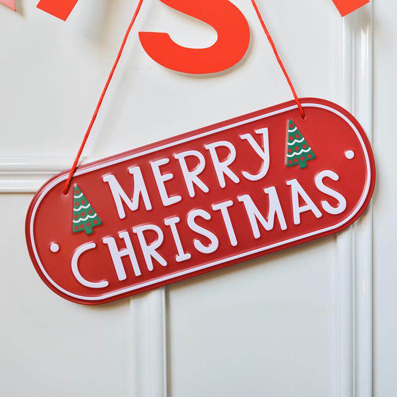 A Christmas red engraved wood with a Christmas tree decorati