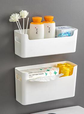 Pluralized plastics on the toilet wall above the toilet, fre